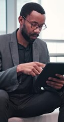 Poster - Business, black man and relax by typing on tablet for project research, update schedule and reading report. African, male person and glasses with digital to review email, feedback information and app