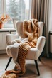 © ArtStage - Cozy armchair with warm throw blanket in a minimalist room  AI generated illustration