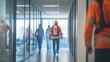 © Georgii - Fire safety training session with professionals wearing protective gear and guiding employees through smoke-filled office hallway