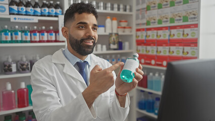 Sticker - Hispanic pharmacist with beard examines medicine in a drugstore