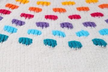 Sticker - Texture of colorful knitted fabric with pattern as background, closeup