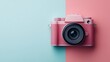 © svastix - An artistic shot highlighting a pink camera against a background split into half pink, half blue. Captures the charm of retro design with a modern twist in color.