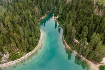 Wall Mural - aerial view of the sharp shore of lake braies in trentino alto adige italy