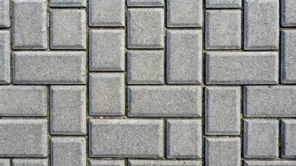 Pattern of gray concrete paving stones on the ground