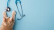 © Ahmed - Cat paws and a stethoscope set against a soft blue background, with ample copy space for a veterinary clinic banner