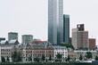 © yaqui_villegas - Panoramic view of a metropolitan skyline featuring both historic and modern buildings, showcasing the architectural diversity and growth of the urban environment in Rotterdam