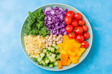 Wall Mural - A colorful salad bowl filled with a variety of vegetables including tomatoes