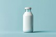 © Jaemie - Glass Bottle of Milk Against Blue Background