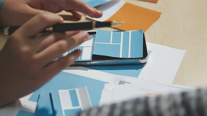 The designer team is designing the uxui system to make the uxui system work well on new phones and support system updates. Website development concept UI UX front end designer