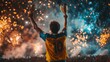 © Pavel Kachanau - The footballer celebrates victory by raising the trophy under a dazzling display of fireworks