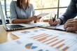 © spyrakot - Professional Financial Planner Consulting Client on Investments and Savings Strategies in Modern Office
