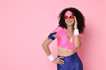 Wall Mural - Aerobics. Happy woman in sportswear on pink background, space for text