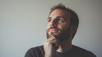 Poster - A man with a beard shows a serious expression while contemplating ideas in a calm indoor setting, surrounded by simplicity. Generative AI