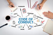 © STOATPHOTO - Code of Conduct Concept. The meeting at the white office table