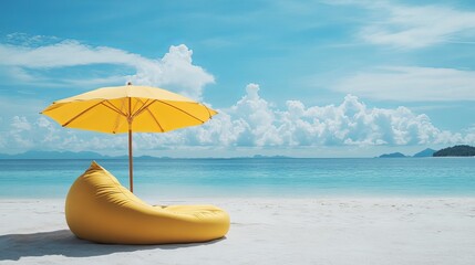 Gorgeous view of Thailand's tropical beach. On the white sand, there is a yellow beach bed, a bean bag chair, and an umbrella to enjoy while gazing out over the azure ocean. 