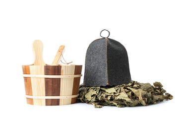 Wooden bucket, felt hat and birch sauna broom on white background