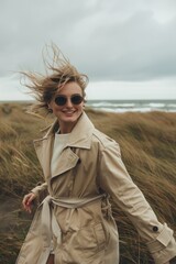 Aufkleber - A woman wearing a trench coat walks through a green field, possibly on her way to somewhere
