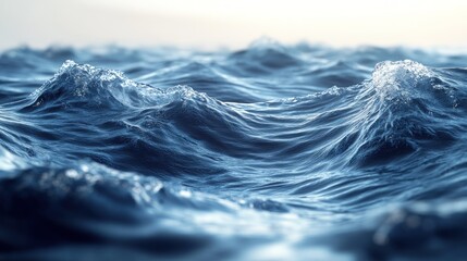 A close-up of the ocean surface with gentle waves and a blue and white color palette.