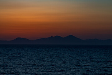 Greek sunsets over the Aegean sea during summer 