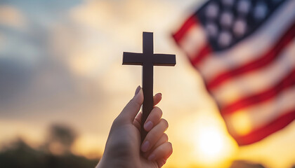 Hand holding cross with American flag in background, religious patriotism, faith and freedom, sunset sky, symbol of belief, Christianity and nationalism, spiritual freedom, USA