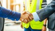 © Marcos - 'Successful Agreement: Contractor and Foreman Shaking Hands on a Partnership Deal for a New Project'
