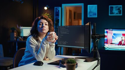 Poster - portrait of happy computer engineer enjoying hot tea while implementing security measures to protect