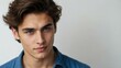 © Alteisen Riese - teen stunning brunette european man with blue shirt model portrait standing straight on a plain white background for ad concept space for text