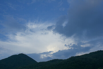 Wall Mural - 
Mountain silhouette and sunset sky.