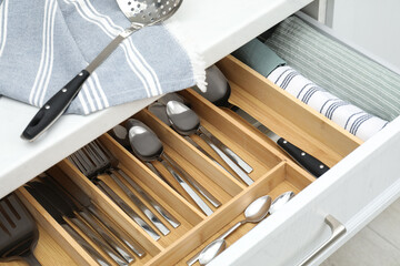 Wall Mural - Box with cutlery in drawer, closeup. Kitchen utensils storage