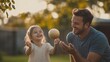 © anong - father and daughter playing catch in the backyard, both smiling and enjoying the moment of connection and fun
