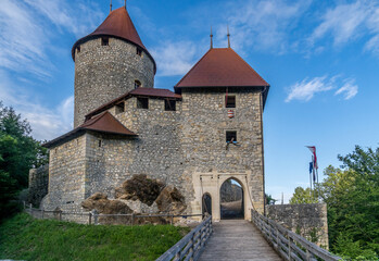 Wall Mural - Newly restored medieval gate tower, battlements, donjon with red roof at Zovnek castle in Slovenia