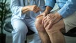 © Napasnan - Doctor demonstrating joint exercises for pain relief to an elderly patient, focused on reducing knee discomfort