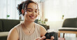 © PeakPoints/peopleimages.com - Break, smile and woman with smartphone, yoga and search on social media, online and relax in home. Fitness, digital and routine for wellness, app and mobile for tips, pilates and healthy in house