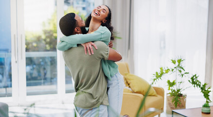 Poster - Home, hug and couple with love, funny and excited with care, relationship and celebration. Apartment, embrace and man with woman, smile and laughing with marriage and achievement in living room