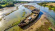 © methinee - Aerial view of abandoned wreck in river Orwell