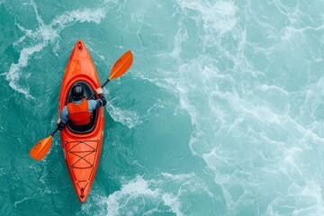 Aerial view of a kayaker navigating through vibrant blue waters, showcasing adventure and outdoor sports.