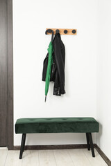 Sticker - Green umbrella, leather jacket, rack and ottoman in hallway