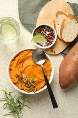 Wall Mural - Delicious mashed sweet potatoes served on light table, top view