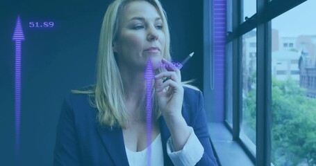 Poster - Holding pen and thinking, woman with data visualization animation over her face