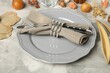 © New Africa - Stylish place setting and autumn decor on grey textured table, closeup