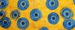 © Georgii - Colorful African wax print cloth with circular patterns in blue and yellow