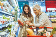 © Dragana Gordic - Happy Women Shopping Together in a Grocery Store