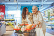 © Dragana Gordic - Happy Women Shopping Together in a Grocery Store