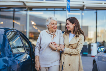 Happy Senior Woman and Young Woman Bonding Outdoors