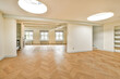 © ADDICTIVE STOCK - Spacious empty room with hardwood floors and natural light