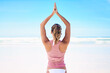 © ThurstanJam/peopleimages.com - Woman, meditation and back for yoga at beach with namaste, spiritual healing and zen exercise for mindfulness. Girl, fitness care and pilates peace with wellness goals, blue sky and nature gratitude