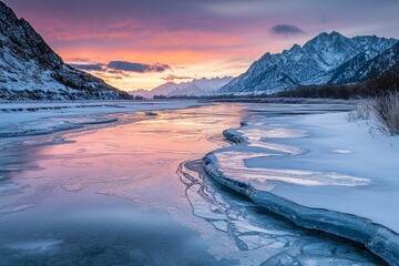 Wall Mural - a half-frozen icy river leading to mountains at the far end