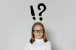 © millaf - Happy young girl child school student with exclamation and question mark. Idea and Education concept