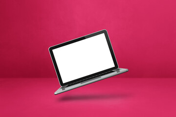 Canvas Print - Floating computer laptop isolated on pink. Horizontal background