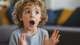 Surprised child expressing emotion, cute toddler reaction, amazed face, kids emotional expression, child wonder, adorable kid surprise, childhood moments, joyful reaction, indoor photography
